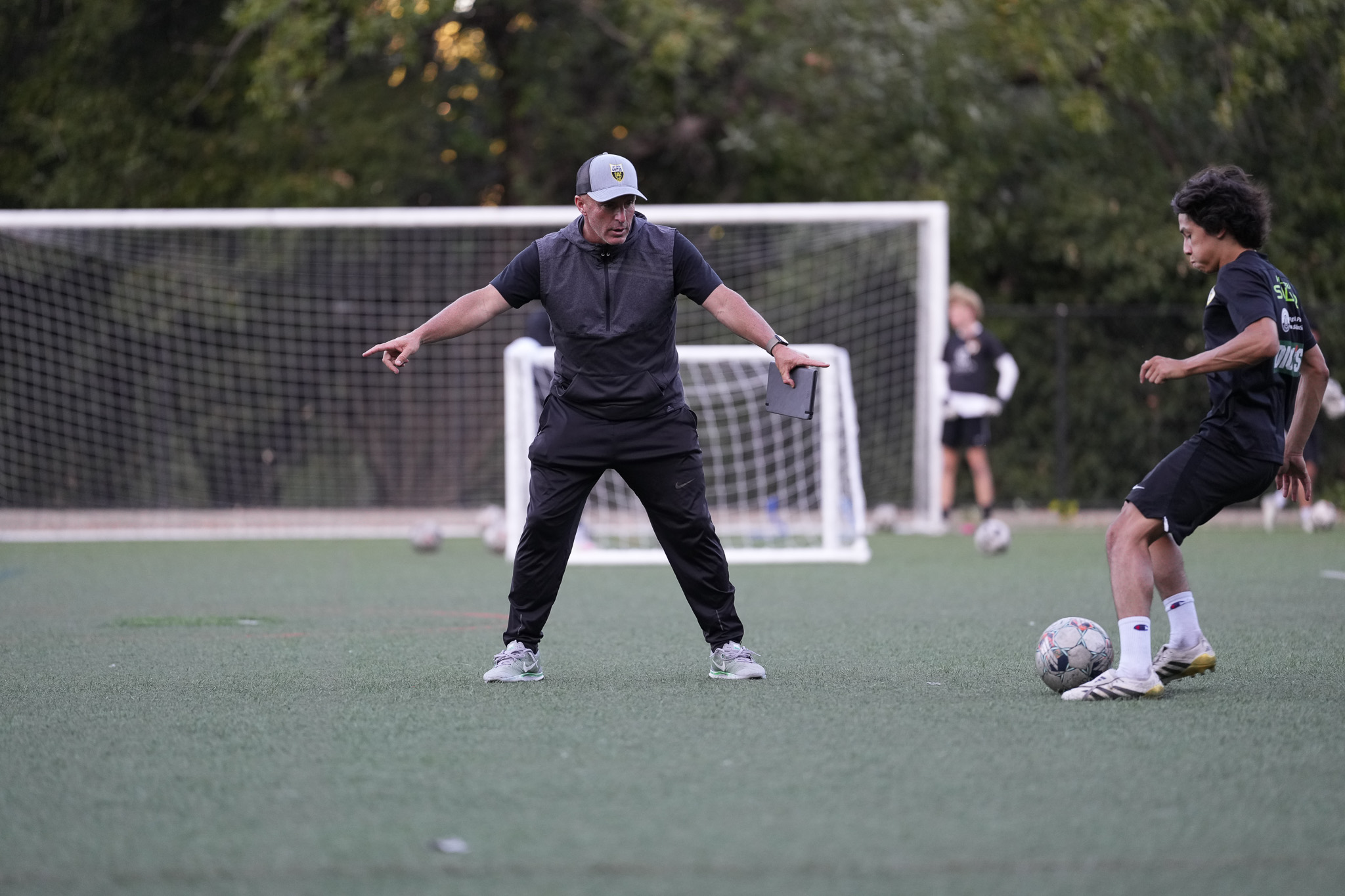 Los Gatos United coach instructing a player during training