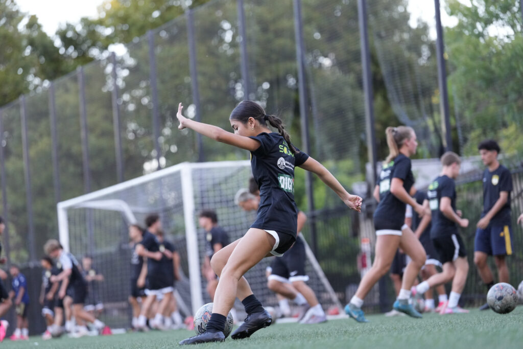 Los Gatos United girls player striking a ball during training