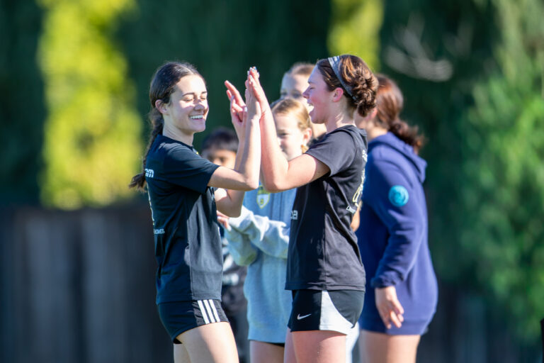 Los Gatos United players high-fiving during December Break Camp